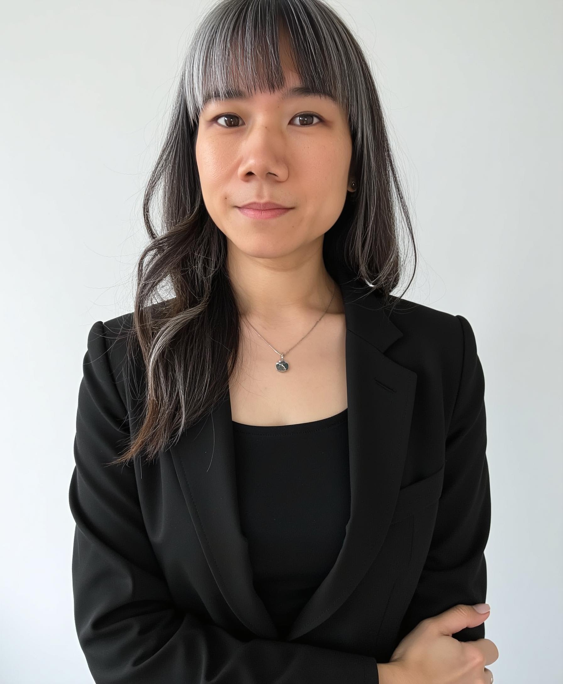 Professional headshot of Maggi Woo, the therapist at Heartsprout Therapy, offering individual, couples, and sex therapy services in Toronto and Vancouver.