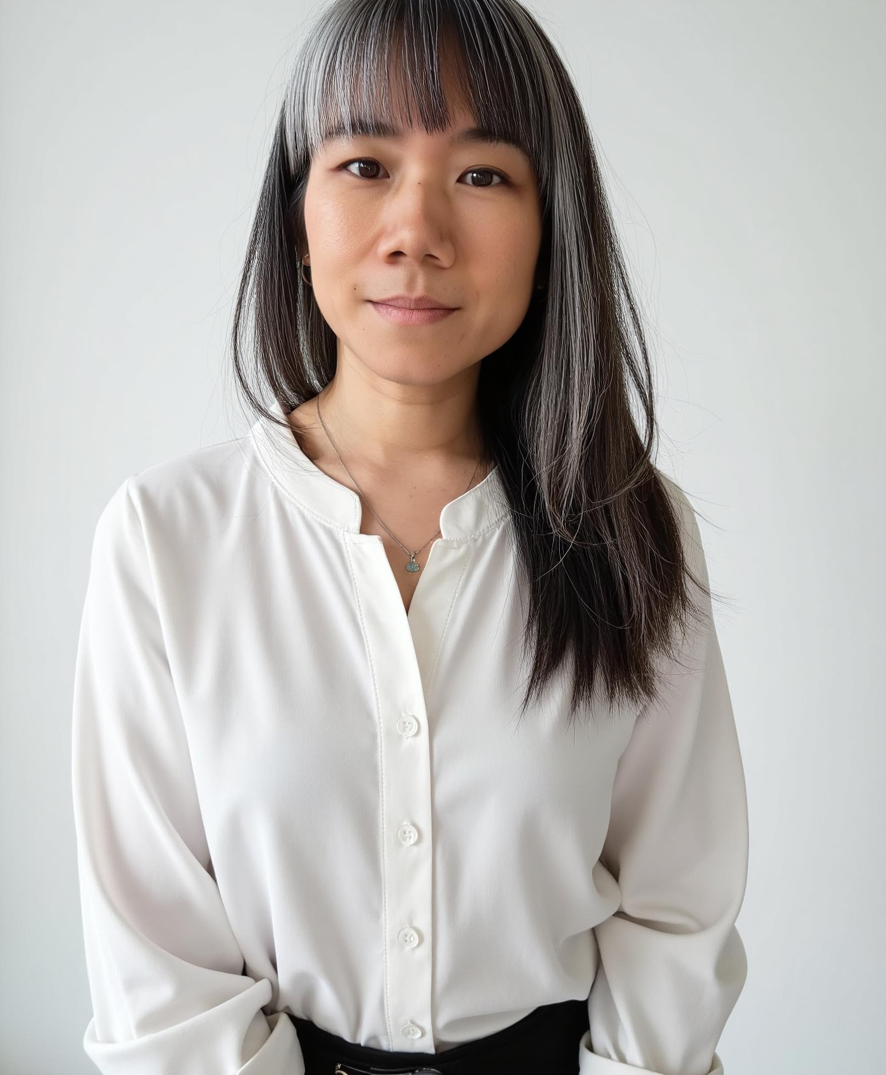 Portrait of Maggi Woo, a calm, compassionate therapist offering grief and loss counselling at Heartsprout Therapy in Toronto and Vancouver, creating a safe space for healing and remembrance.